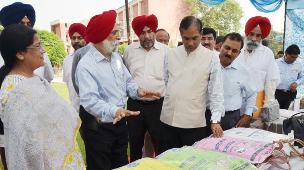 Dr. A. S. Nanda, Vice Chancellor and other officers brief the exhibit stall  to Dr. Trilochan Mohapatra, DG, ICAR on the visit of University on dated 8-10-2018