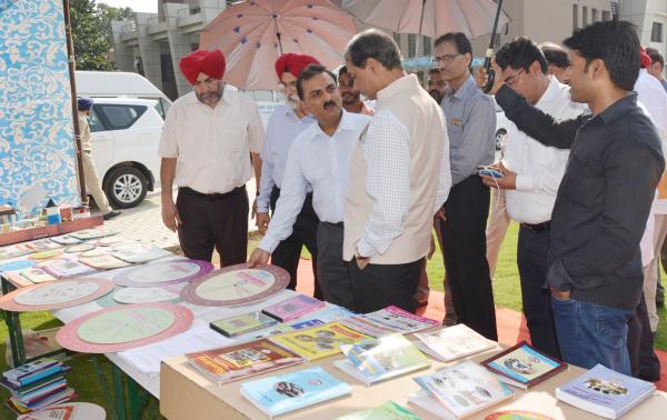 Dr. A. S. Nanda, Vice Chancellor, Dr. H.K.Verma, Director of Externsion Education and other officers brief the exhibit stall  to Dr. Trilochan Mohapatra, DG, ICAR on the visit of University on dated 8-10-2018